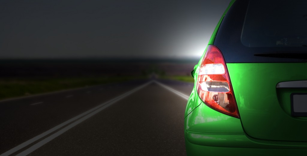 Green car on the road